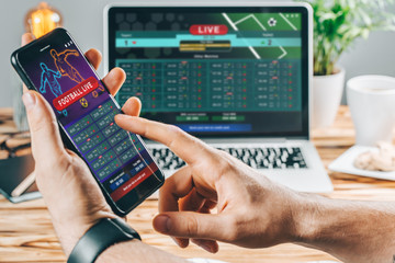 Man celebrating victory after making bets at bookmaker website