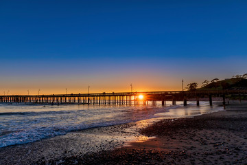 Sunburst through Pier at Sunset