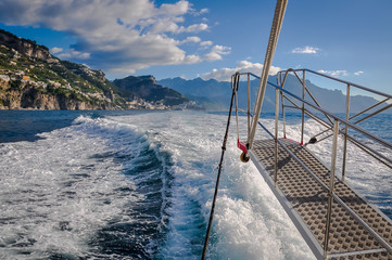 Fototapeta na wymiar Summer panorama of villages in the Amalfi coast seen from sailing boat