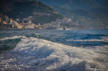 Panorama of the town of Amalfi from the sea with sailing boat