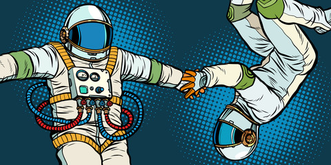 a couple in love, astronauts holding hands © studiostoks