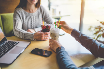 Two girls sitting in cafe