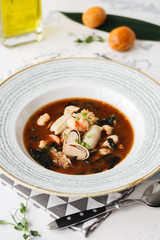Asian soup with ice mushroom, squid, shrimp. Restaurant feed.