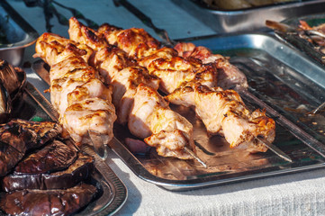 street food skewers, meat is fried on the fire, the process of cooking meat on the fire