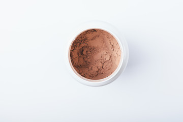 Open container of chocolate protein powder