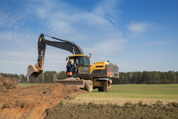 Dumper and construction machinery rides and performs work in the city