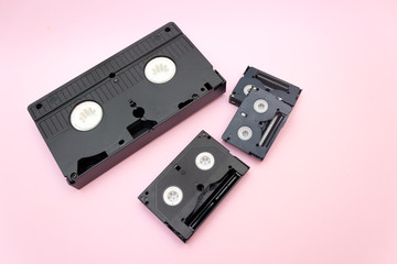 VHS and mini dv video tapes cassette on Pink background