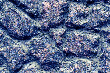 Texture of old stone wall. Great design for any purpose. Photo toned in beautiful blue tones.