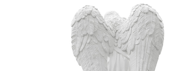 Close up of angel with wings. Vintage ancient stone statue isolated on white background.