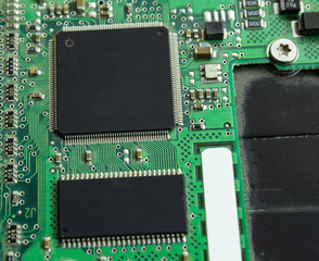 Computer board with a processor and transistors.