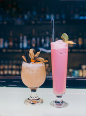 Sweet juicy pink and white Cocktail drink -beverage on a bar counter . Close-up Top view . Trendy stylish edit . Copy paste space for design people and luxury concept service barman in nightclub