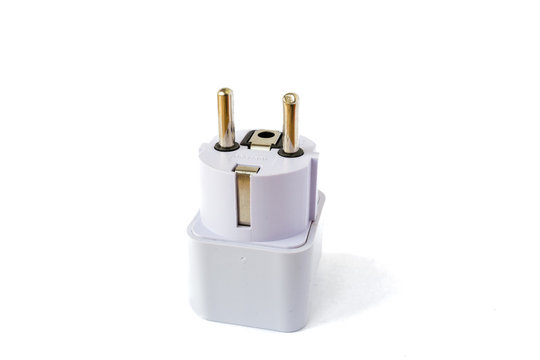 EU white plug, with an earth connection, isolated on white background. USA, EU, UK, Australia Europlug adapter with the pins pointing up.