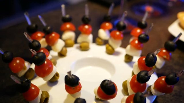 Tomato cherry, olives and mozzarella brochettes