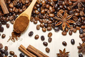 Coffee and spices on a light wooden table