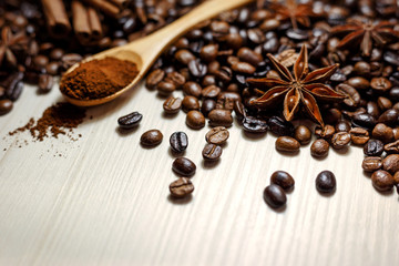 Coffee and spices on a light wooden table