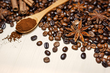 Coffee and spices on a light wooden table
