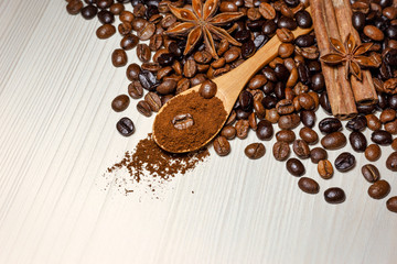 Coffee and spices on a light wooden table