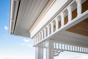 Closeup angled view of PVC millwork, pillars, and woodwork on home residence.