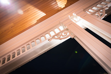 Night view of PVC millwork, pillars, and woodwork on home residence.