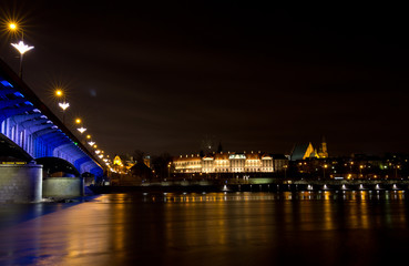 Fototapeta na wymiar bridge at night, view of the river bridge and old town in Warsaw, Poland
