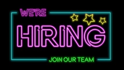 Multicoloured neon sign of the word 'We're hiring - join the team’ flickering neon lights on black background loop. 4k - Powered by Adobe