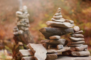 Stack of stones in forest. Space for text