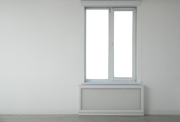 Fototapeta na wymiar New modern window in light empty room. Space for text