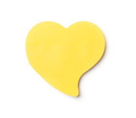 Heart shaped sticky note on white background. School stationery