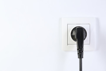 Power socket and plug on white background. Electrician's equipment