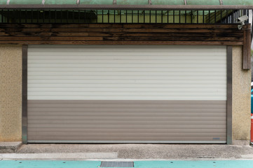 A closeup shot of automatic metal roller door used in factory, storage, garage, and industrial...