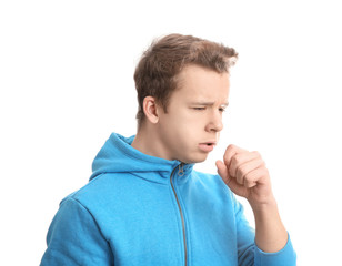 Teenage boy suffering from cough isolated on white