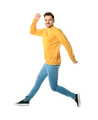 Full length portrait of happy handsome man jumping on white background