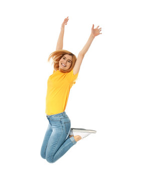 Full length portrait of happy beautiful woman jumping on white background