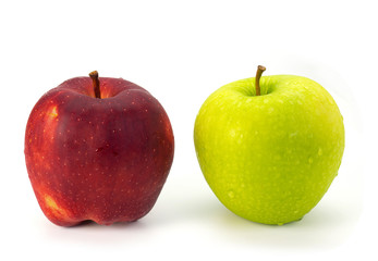 Red and green apples on white background.