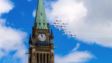 Fototapeta na wymiar Royal Canadian Air Force flypast Parliament House on Canada Day, Ottawa, Canada