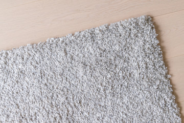 Beige furry carpet on the floor
