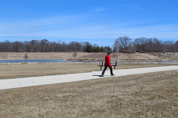 Woman walking on a path at Independence Grove in Libertyville, Illinois