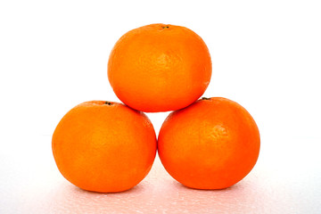 Close up of golden orange isolated on white background with copy and paste space