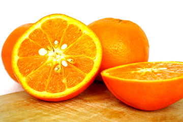 Close up of golden orange isolated on white background with copy and paste space