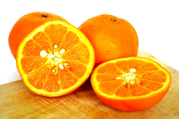 Close up of golden orange isolated on white background with copy and paste space