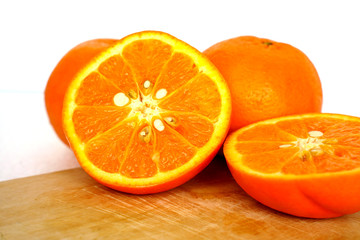 Close up of golden orange isolated on white background with copy and paste space