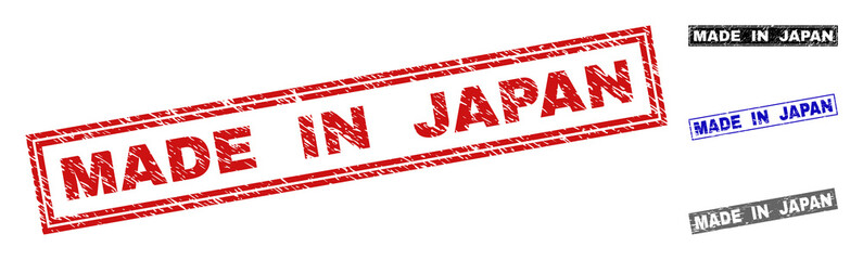 Grunge MADE IN JAPAN rectangle stamp seals isolated on a white background. Rectangular seals with grunge texture in red, blue, black and gray colors.