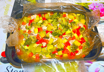 Fresh vegetables with chicken fillet, baked in the oven, in the sleeve