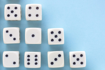 White gaming dices on light blue background. victory chance and lucky. Flat lay style, place for text. Top view and Close-up cube. Concept business, gamble and game. Spectacular background pastel.