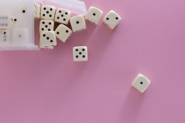 White gaming dices on violet background. victory chance and lucky. Flat lay style, place for text. Top view and Close-up cube. Concept business, gamble and game. Spectacular background pastel.