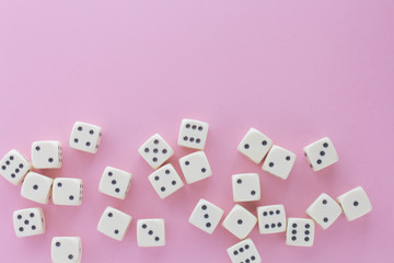 White gaming dices on violet background. victory chance and lucky. Flat lay style, place for text. Top view and Close-up cube. Concept business, gamble and game. Spectacular background pastel.