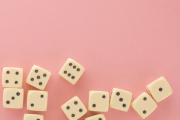 White gaming dices on pink background. victory chance and lucky. Flat lay style, place for text. Top view and Close-up cube. Concept business, gamble and game. Spectacular background pastel.