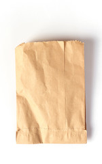 Obraz premium Brown paper bag isolated on white background.