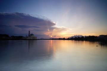 Fototapeta premium wonderful burning sunset with mosque