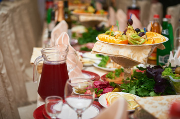 Decorated table with a drink and fruit.